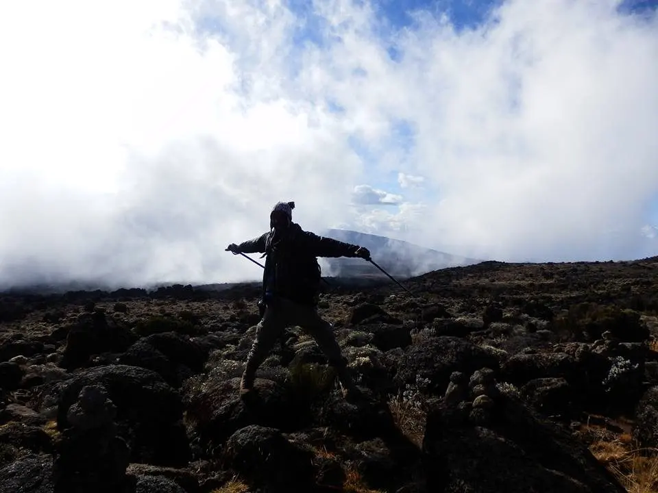 A local guide on the slopes of Mount Kilimanjaro